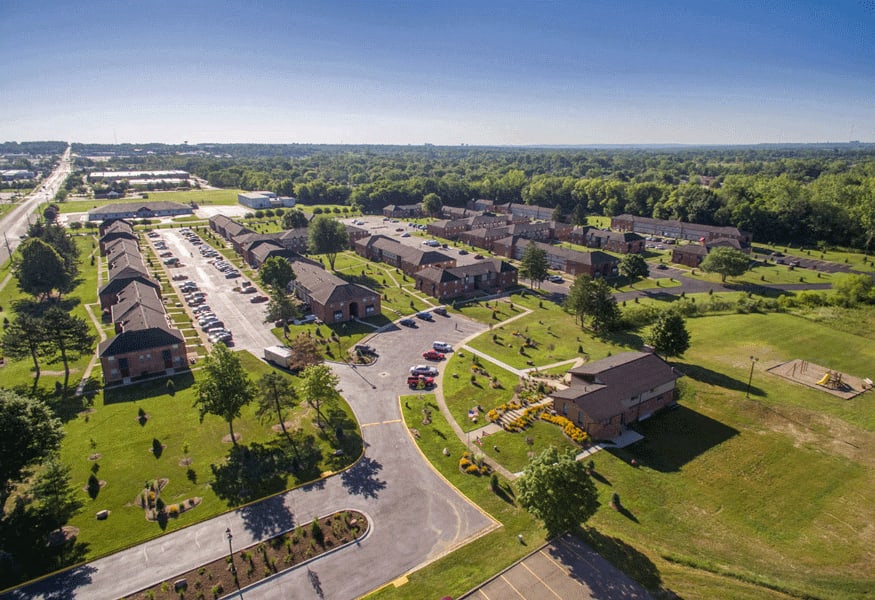 arial view of a neighborhood with houses and lawns